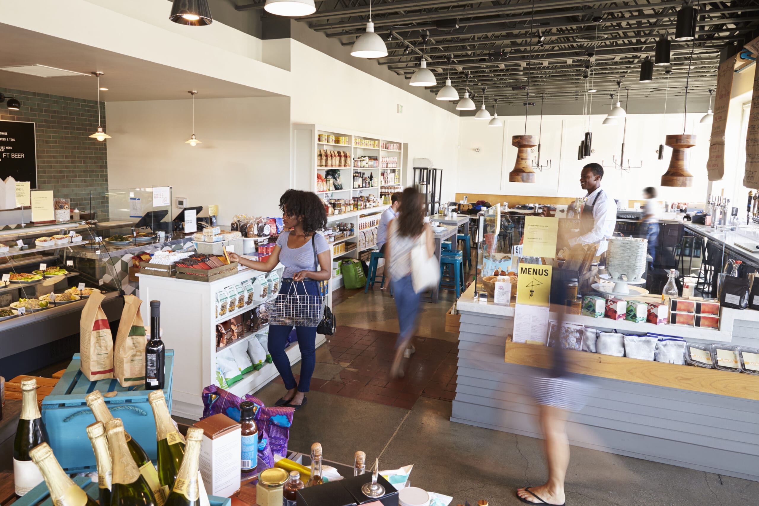 Interior Of Busy Delicatessen With Customers
